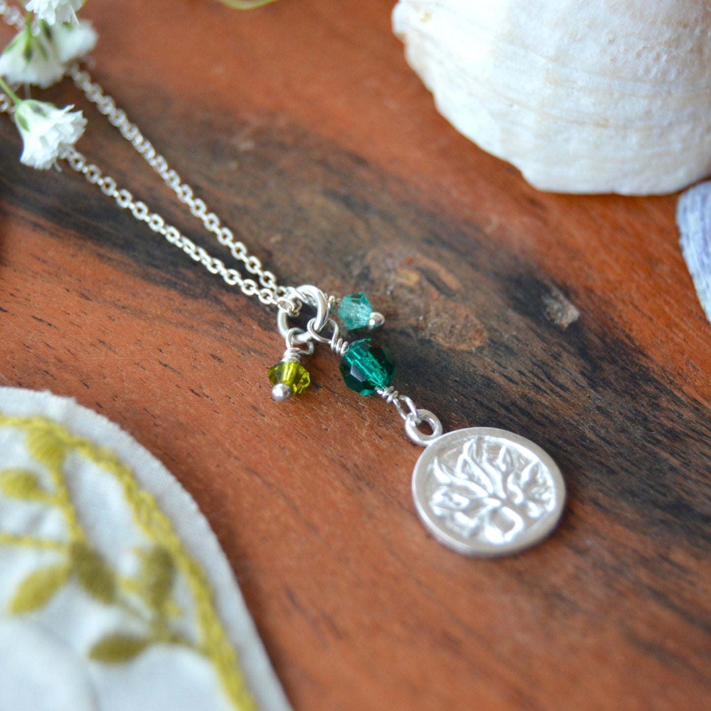 Sterling silver necklace decorated with Tree of Life charm and Czech faceted glass bicones and a crystal.