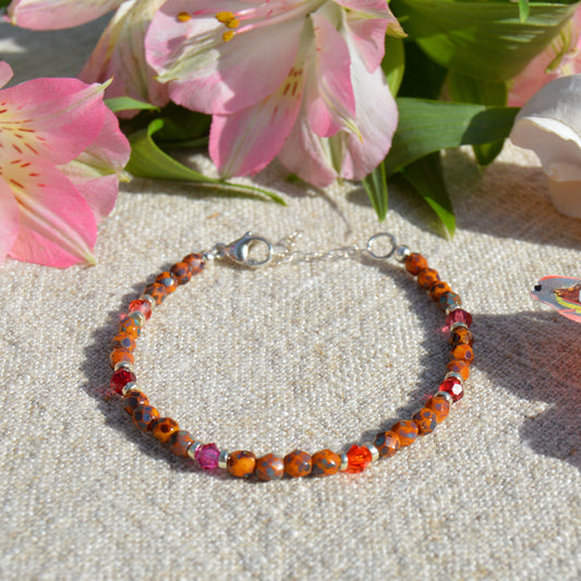 Sterling silver bracelet made of Czech faceted beads, bicones and crystals. Wild pink.