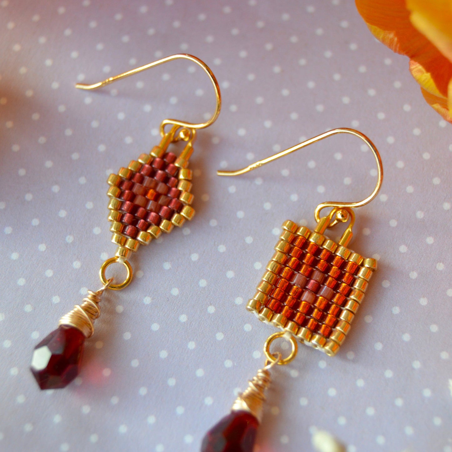 Scheherazade woven earrings with the different designs combined in one pair.