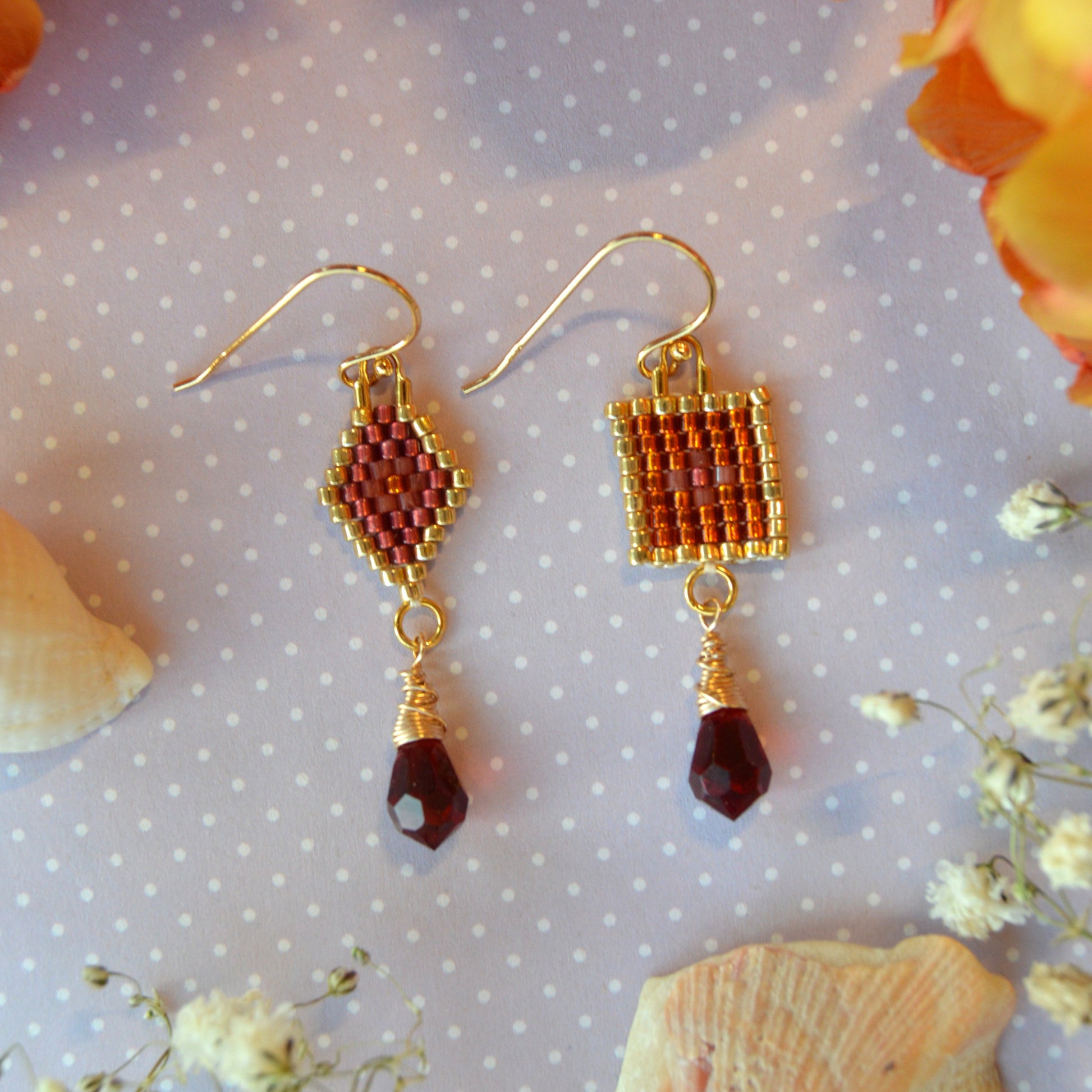 Scheherazade woven earrings with the different designs combined in one pair.