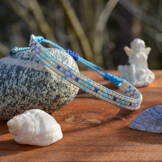 Woven bracelet with Flower design made of Japanese glass seed beads with macrame details.