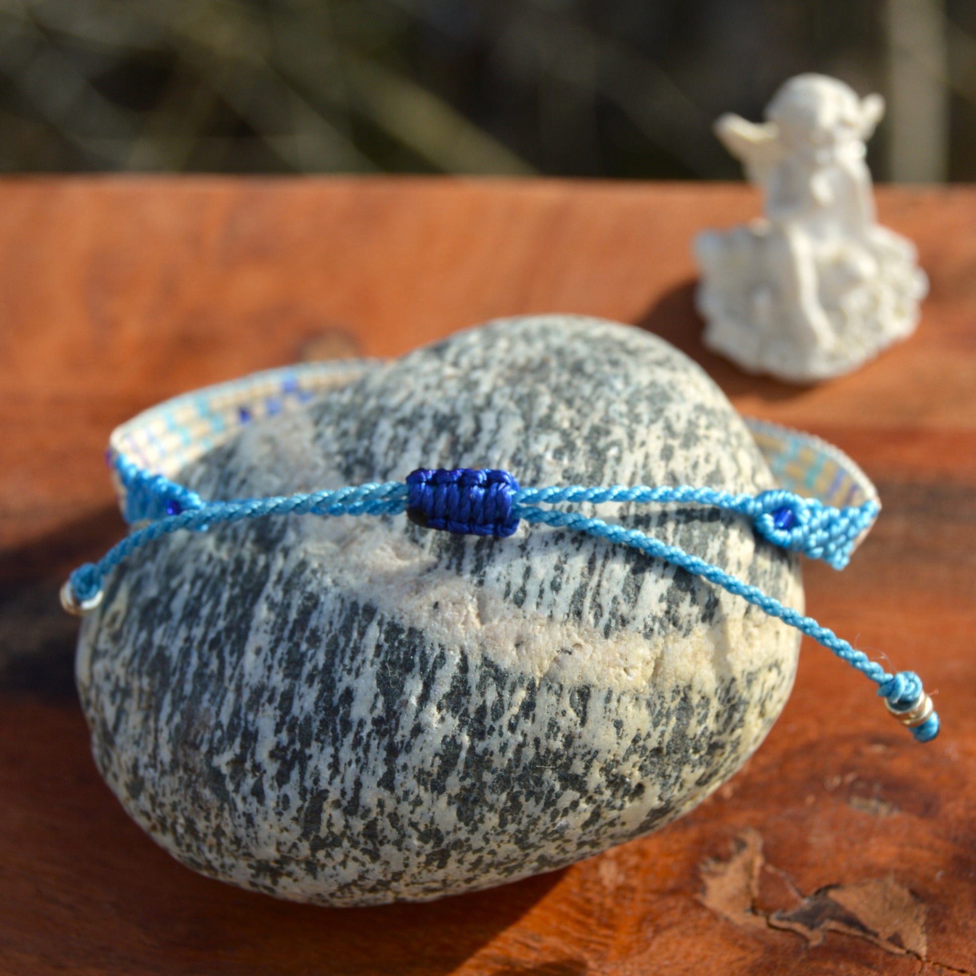 Woven bracelet with Flower design made of Japanese glass seed beads with macrame details and adjustable lock.