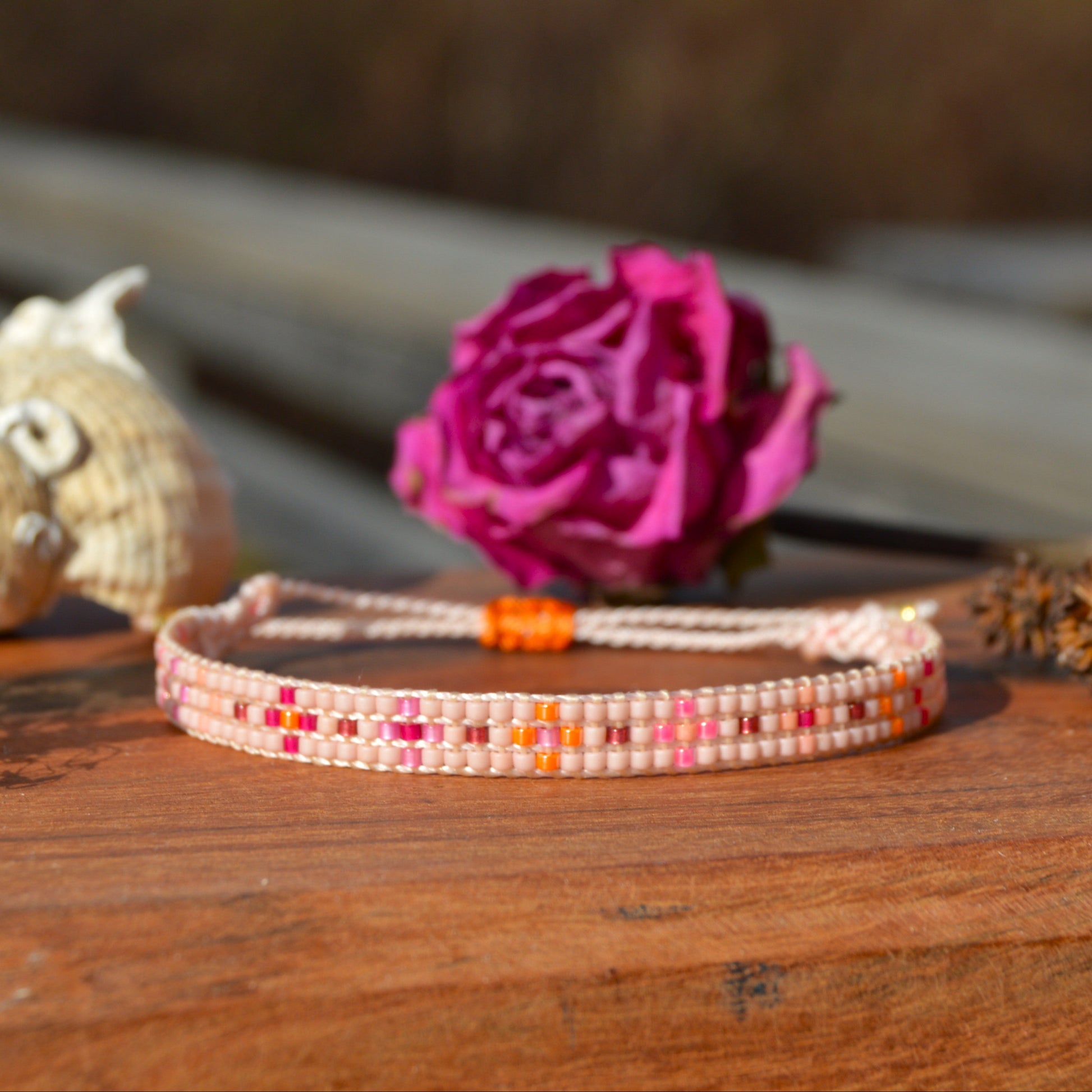 Woven beaded bracelet made of Japanese seed beads with macrame details.