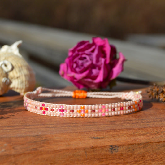 Woven beaded bracelet made of Japanese seed beads with macrame details.