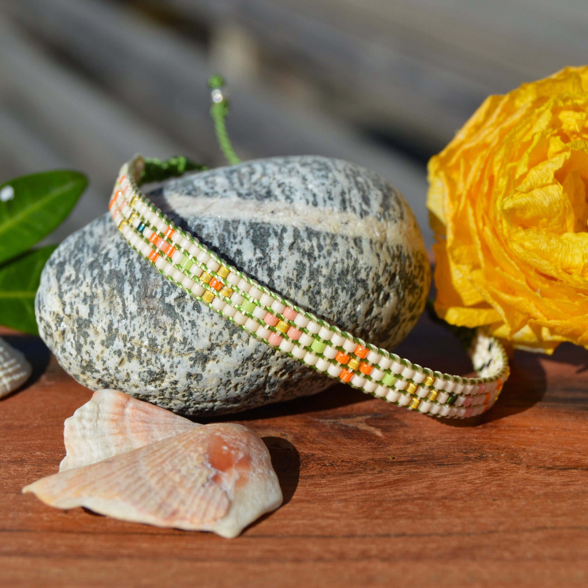Woven bracelet with Flower design made of Japanese glass seed beads with macrame details.