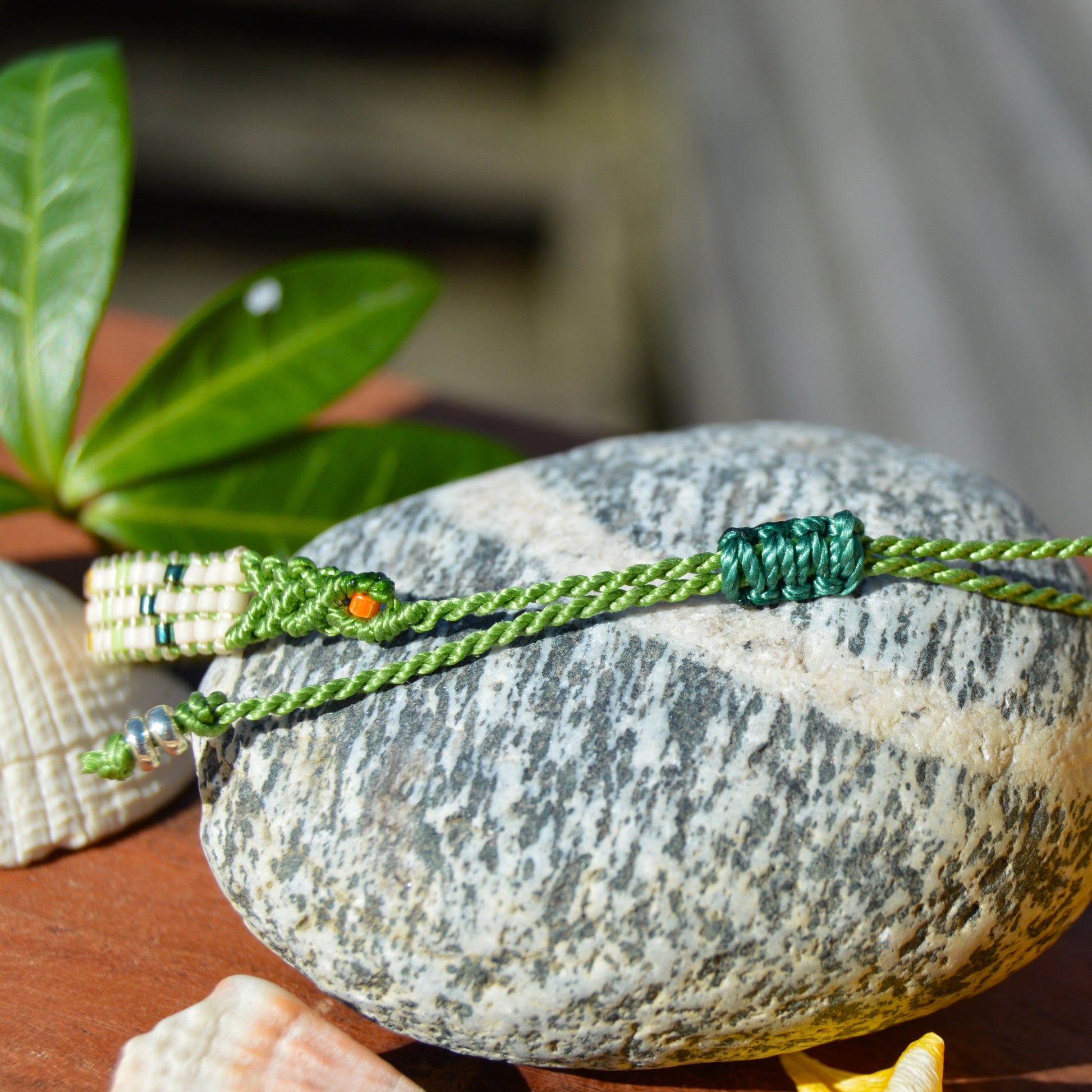 Woven bracelet with Flower design made of Japanese glass seed beads with macrame details.