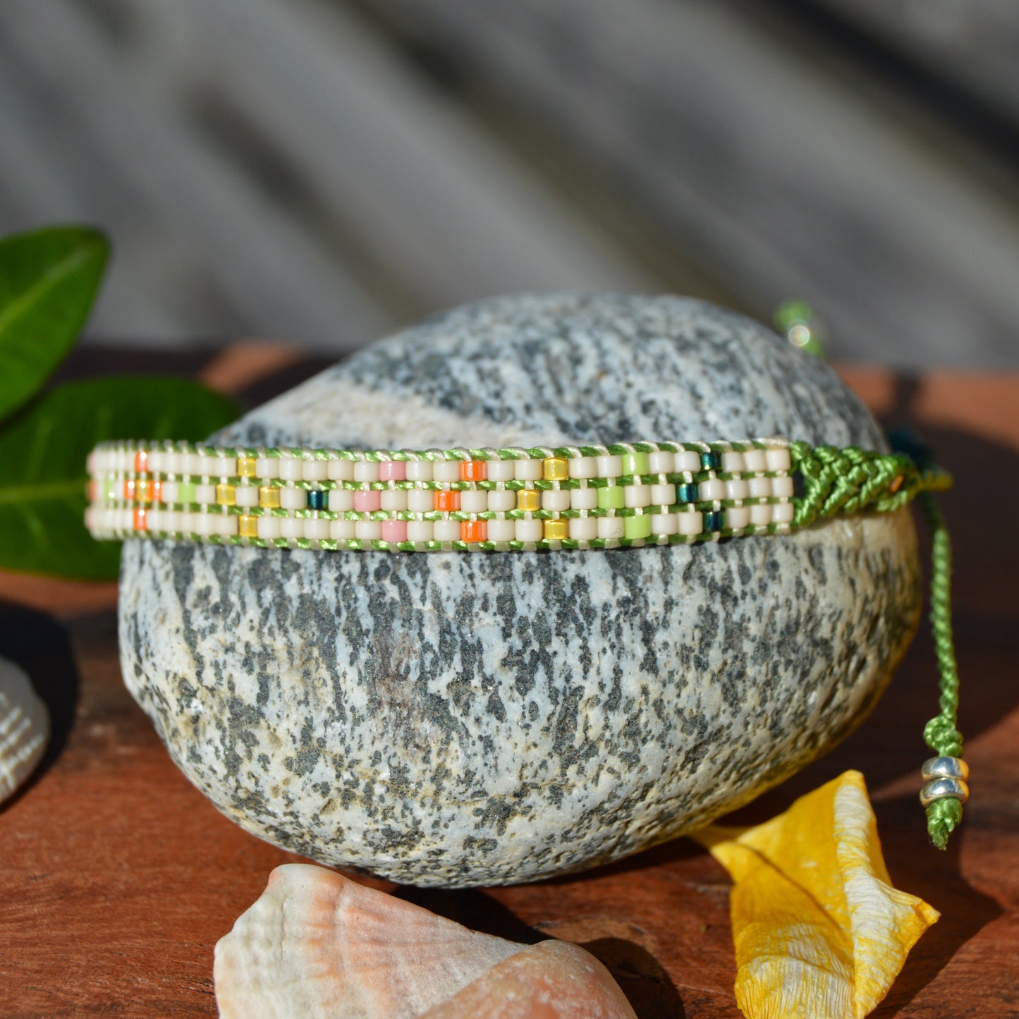 Woven bracelet with Flower design made of Japanese glass seed beads with macrame details.