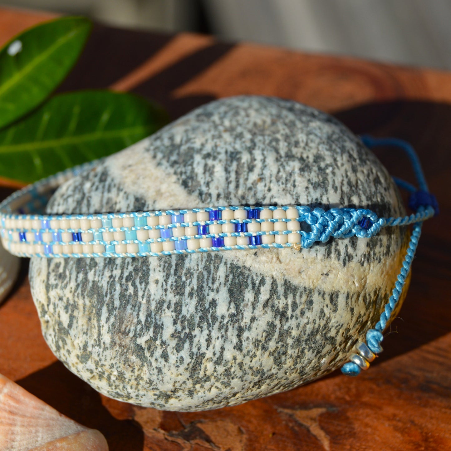 Woven bracelet with Flower design made of Japanese glass seed beads with macrame details.