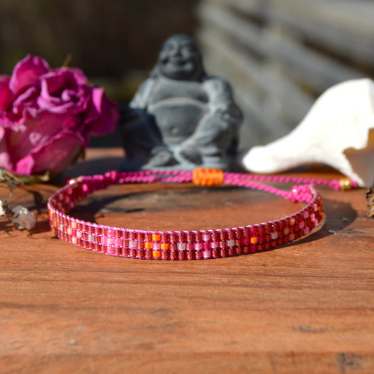 Woven beaded bracelet made of Japanese seed beads with macrame details.
