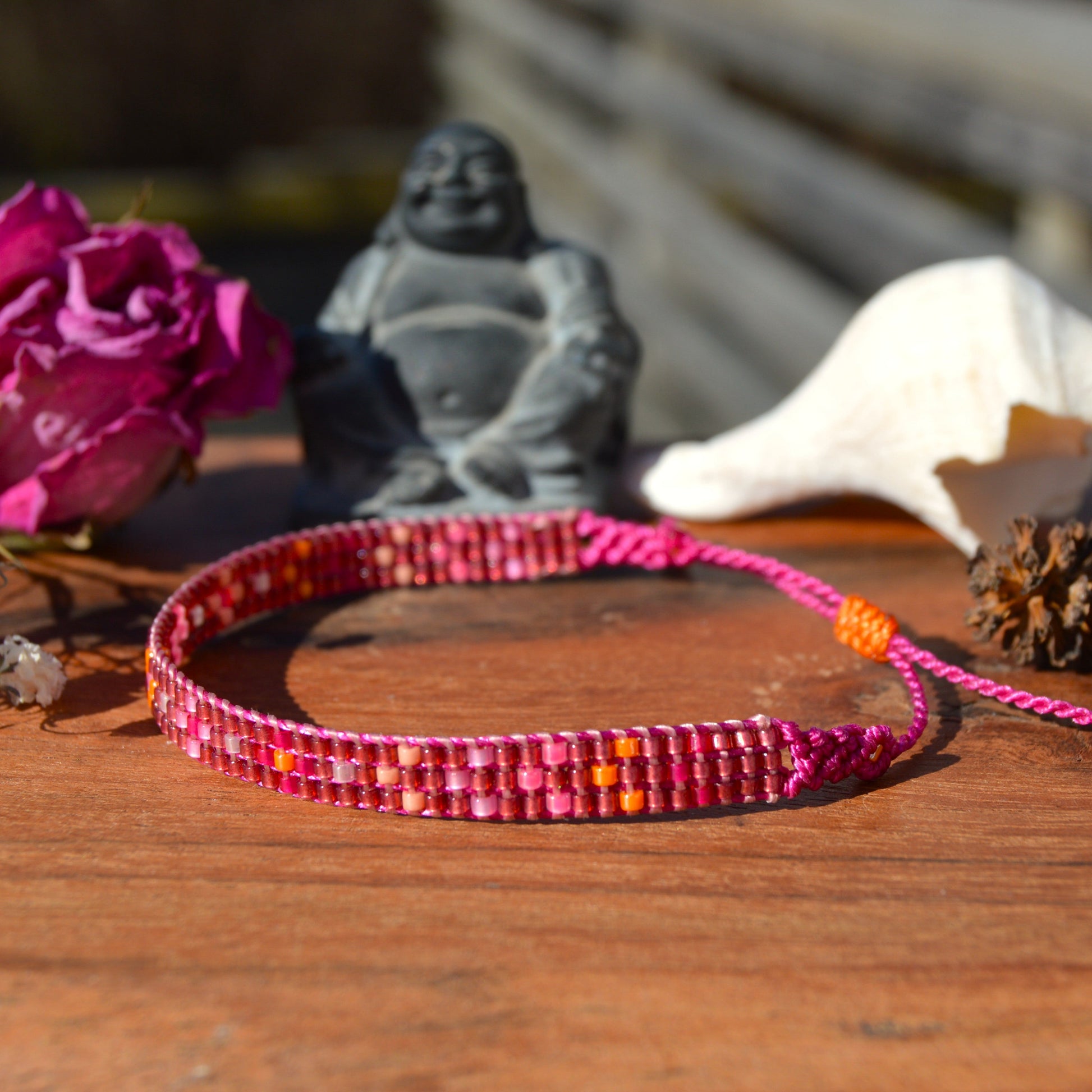 Woven beaded bracelet made of Japanese seed beads with macrame details.