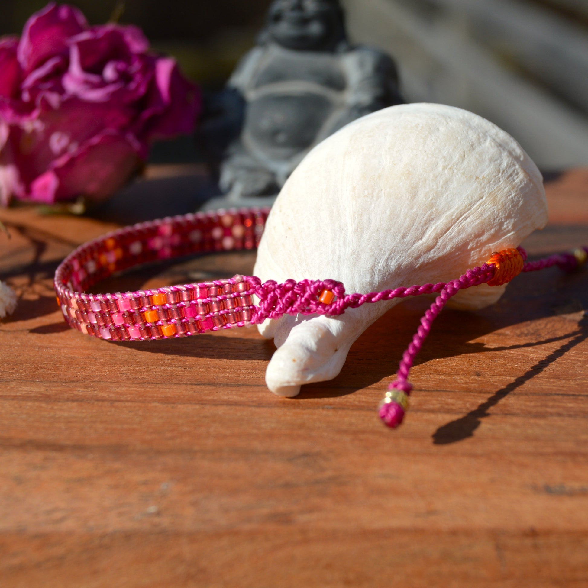 Woven beaded bracelet made of Japanese seed beads with macrame details.