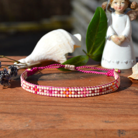 Woven beaded bracelet made of Japanese seed beads with macrame details.