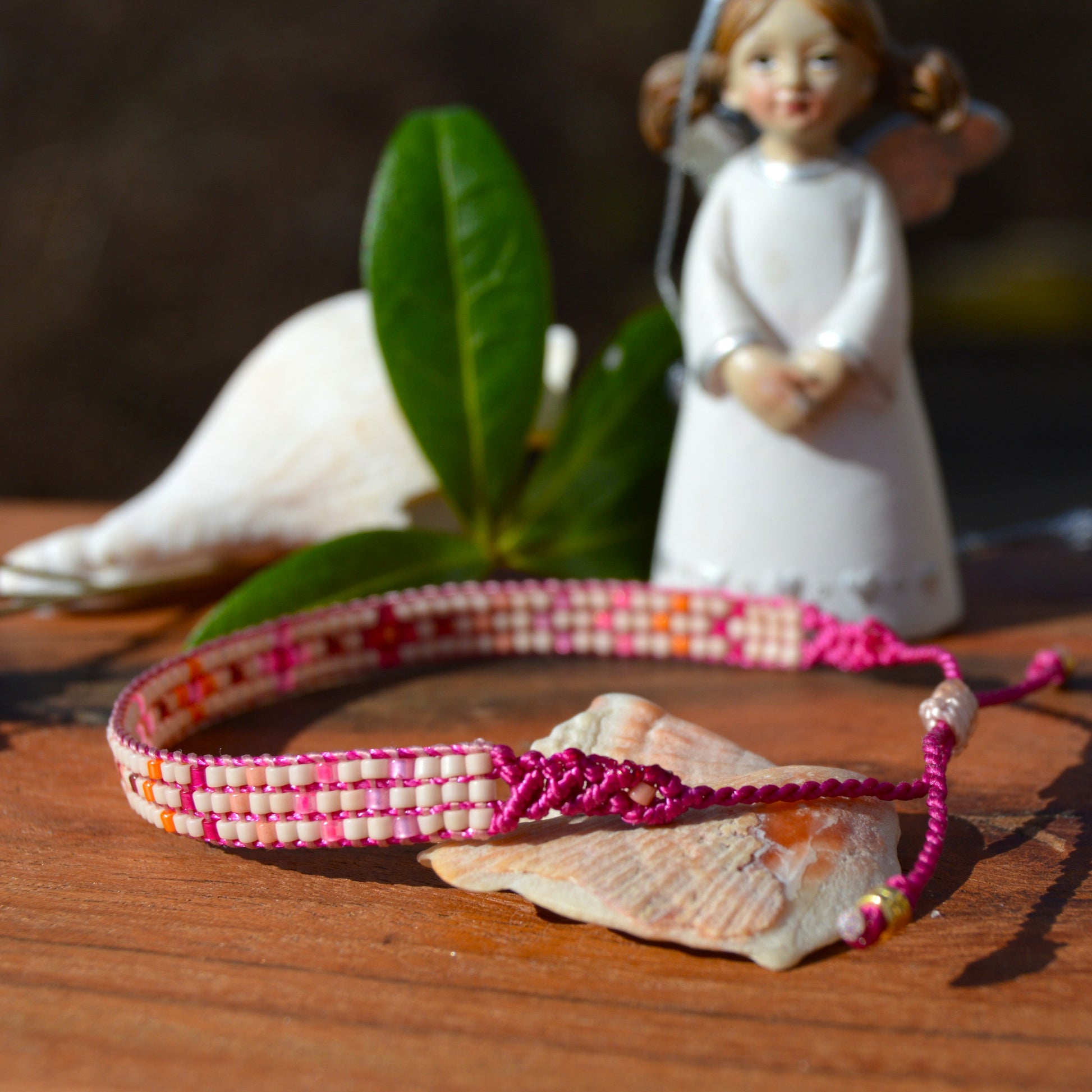 Woven beaded bracelet made of Japanese seed beads with macrame details.