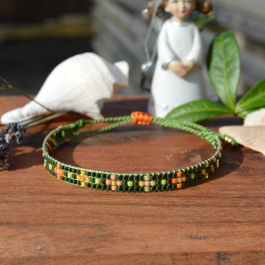Woven beaded bracelet made of Japanese seed beads with macrame details.