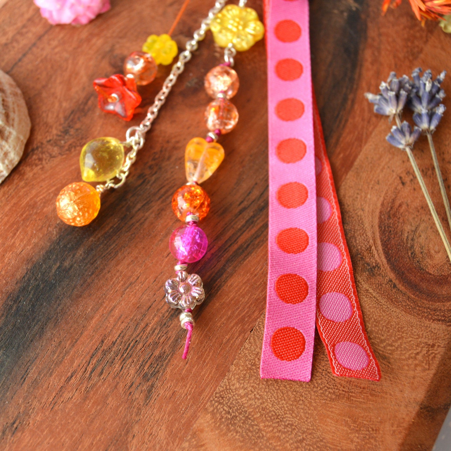 Handbag charm with Czech beads and ribbon in yellow, orange, pink, and red tones.