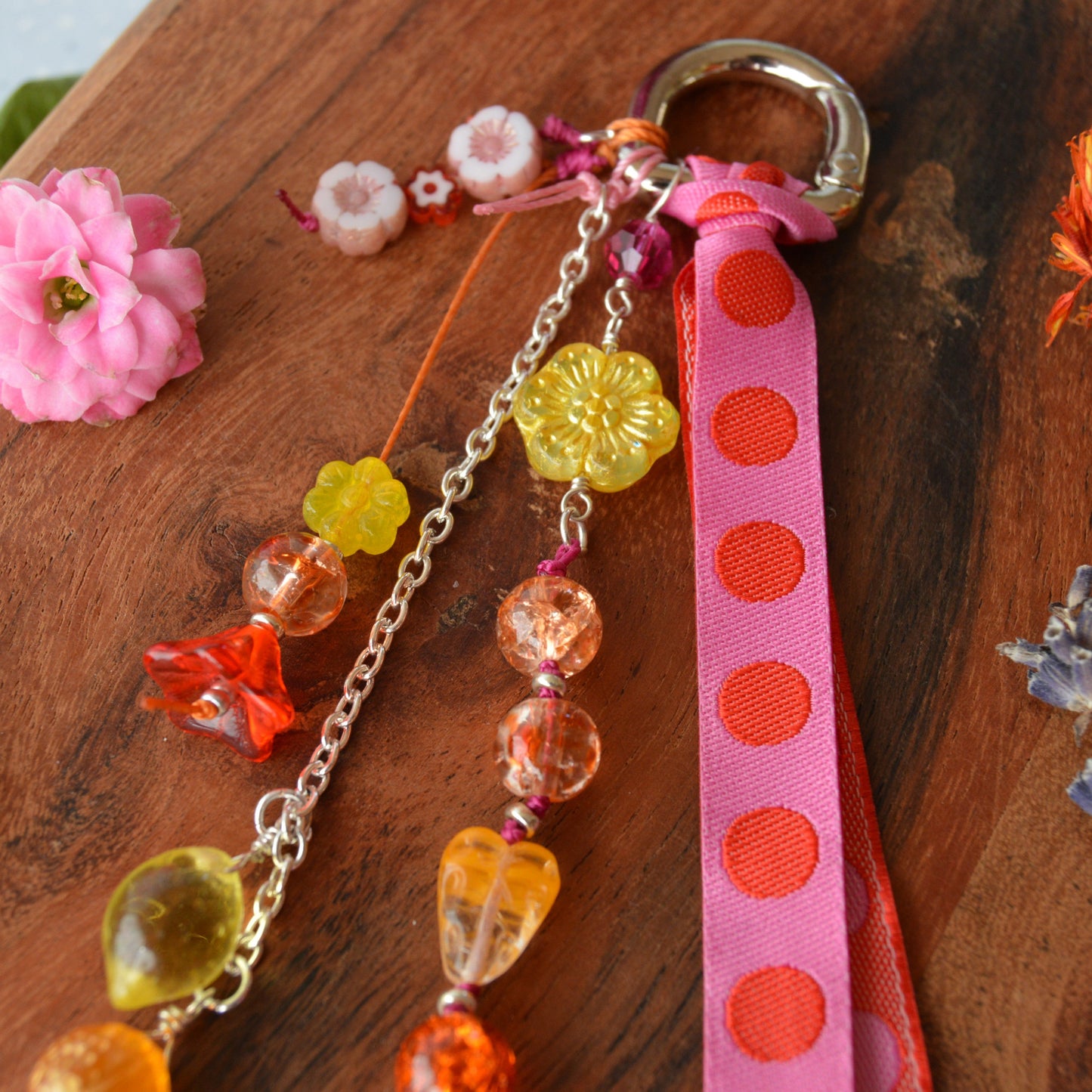 Handbag charm with Czech beads and ribbon in yellow, orange, pink, and red tones.