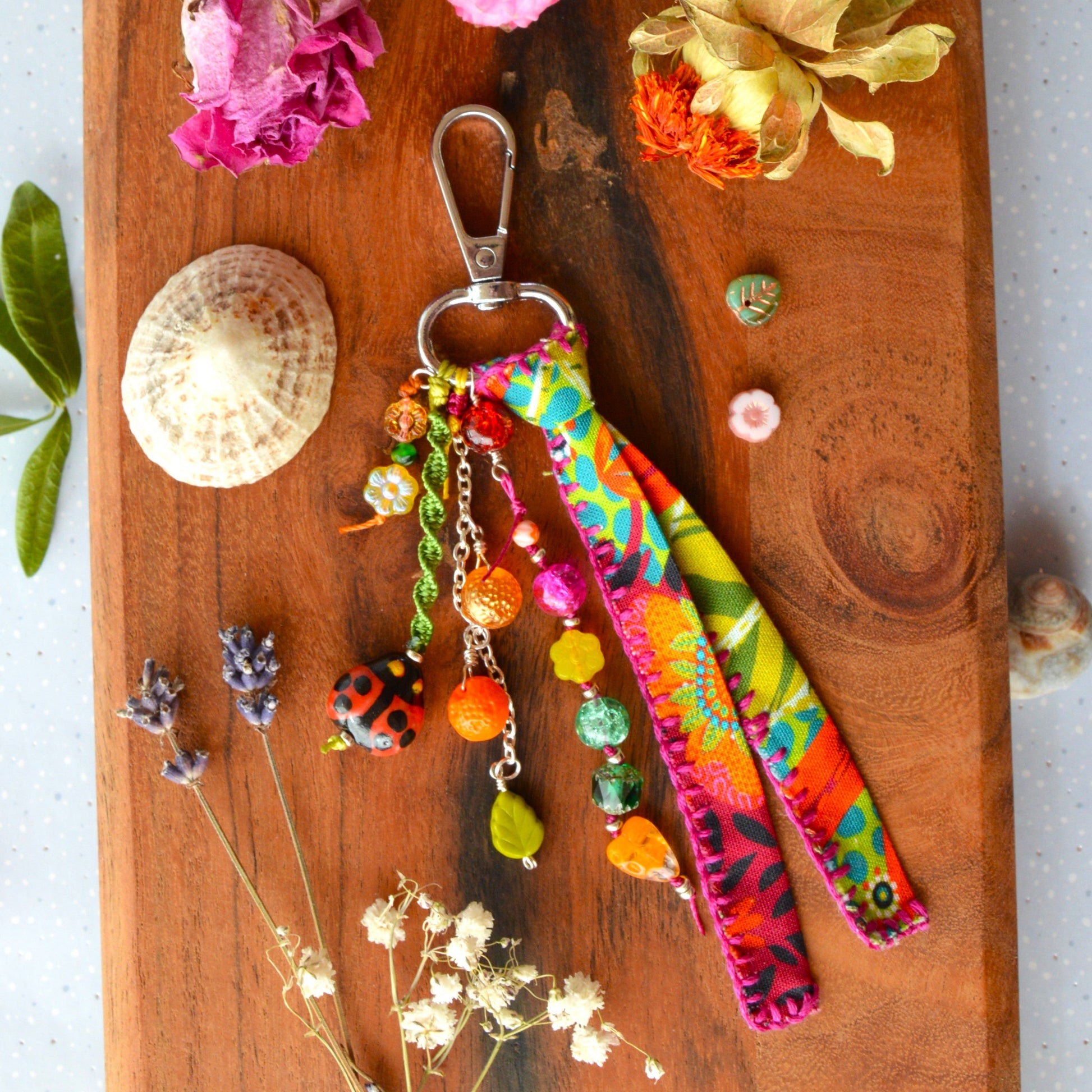 One of a kind colourful bag charm with ladybag, fruit- og flower glass beads.