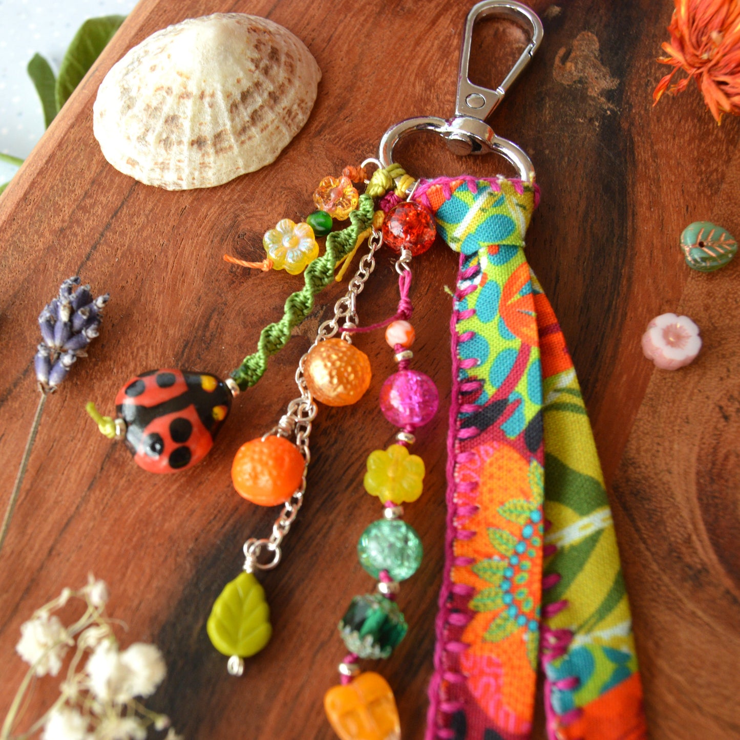 One of a kind colourful bag charm with ladybag, fruit- og flower glass beads.