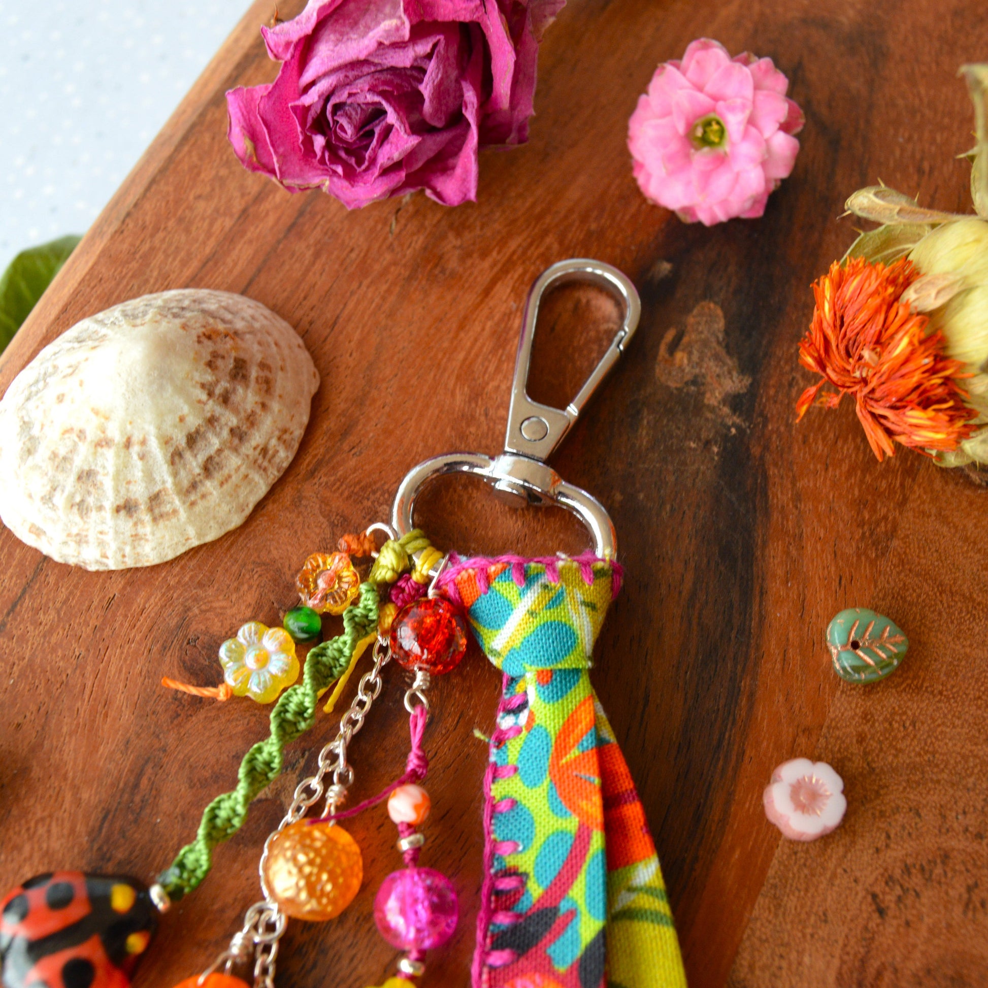 One of a kind colourful bag charm with ladybag, fruit- og flower glass beads.
