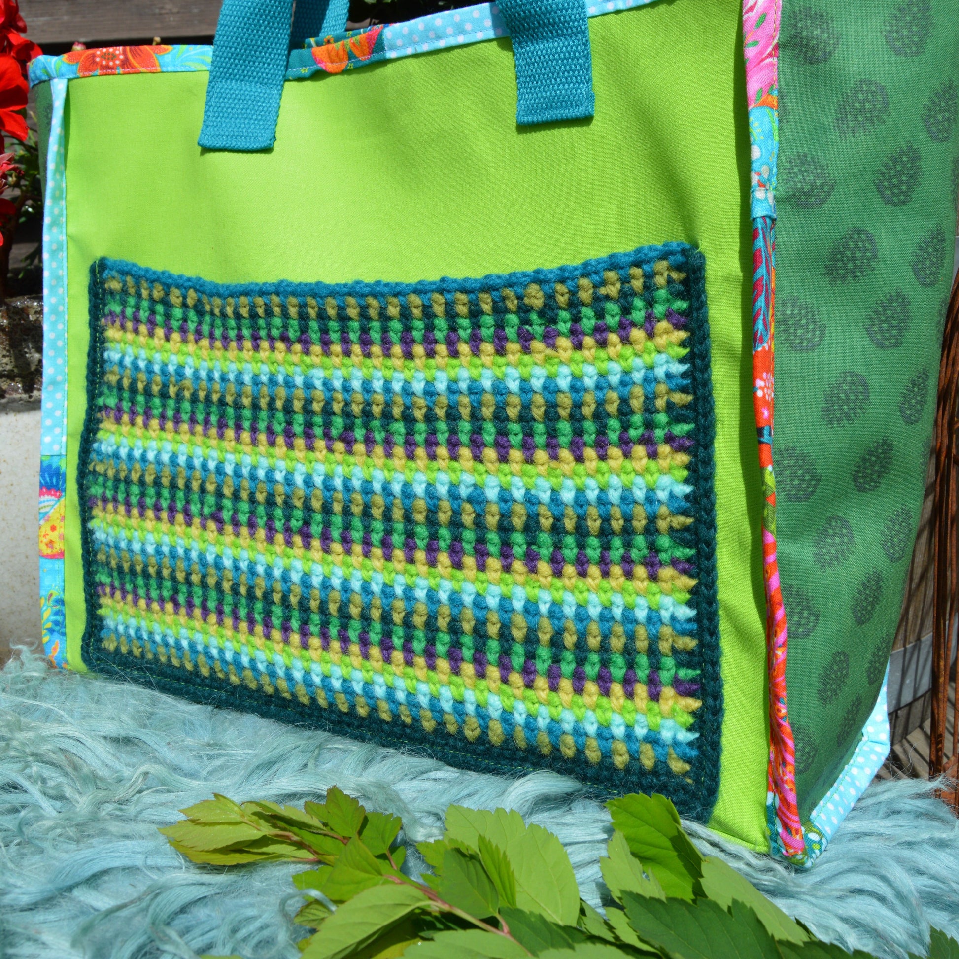 Crochet wool pocket in geometrical design.