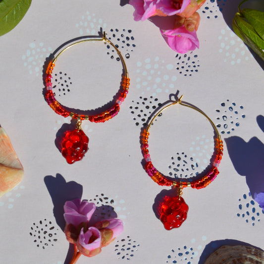 Colourful gold-plated sterling silver earrings decorated with micro macrame, Czech glass seed beads, and Czech glass grape fruit charm.