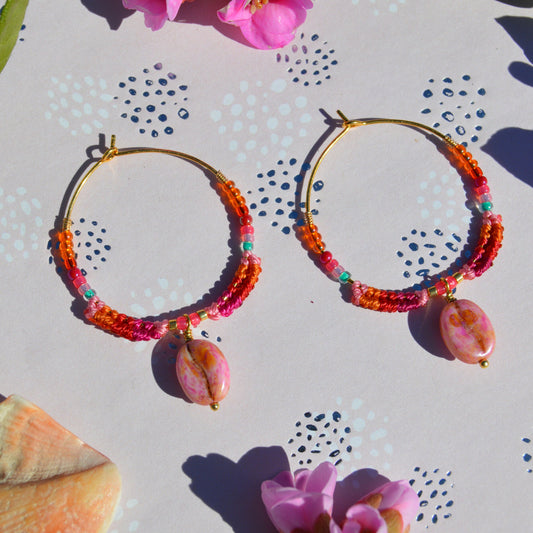Colourful gold-plated sterling silver earrings decorated with micro macrame, Czech glass seed beads, and Czech glass coffee bean charm.