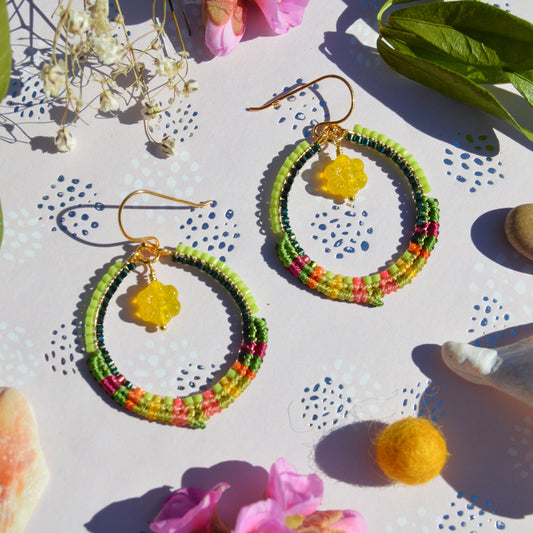 Colourful gold-plated sterling silver hoop earring decorated with micro macrame and woven Japanese seed beads. Czech glass flower charm.