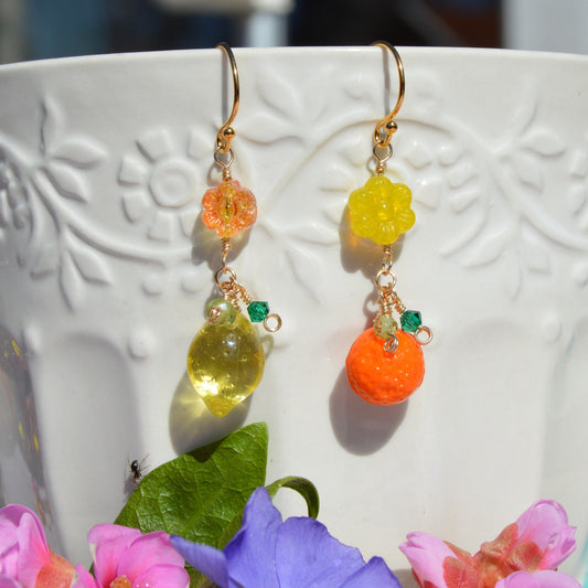 Gold-plated sterling silver earrings featuring Czech glass flower and fruit beads, faceted bicones, and olivine gemstone.