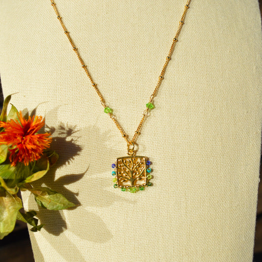 Gold-plated sterling silver necklace with Tree of Life pendant woven with Japanese seed beads.