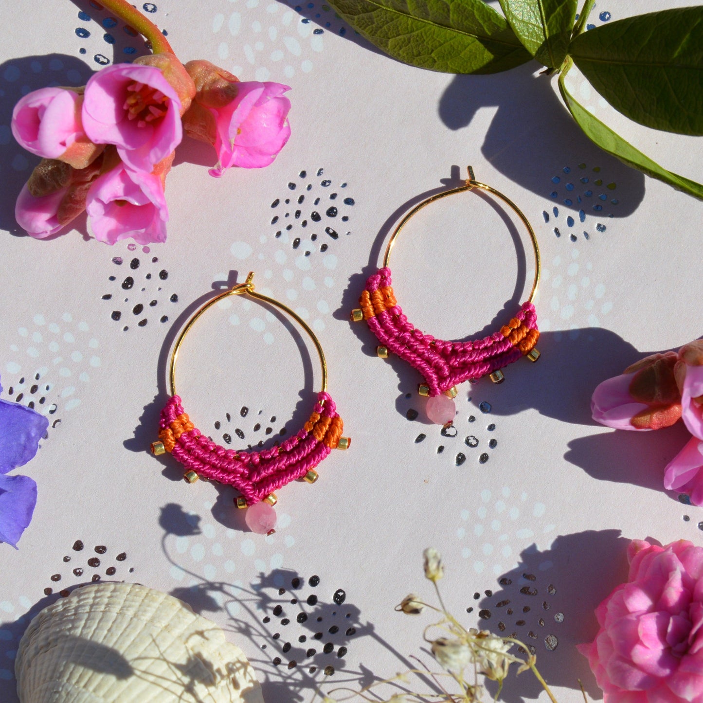 Small gold-plated sterling silver creole with macrame details in cerise pink & orange colour and a tourmaline gemstone.