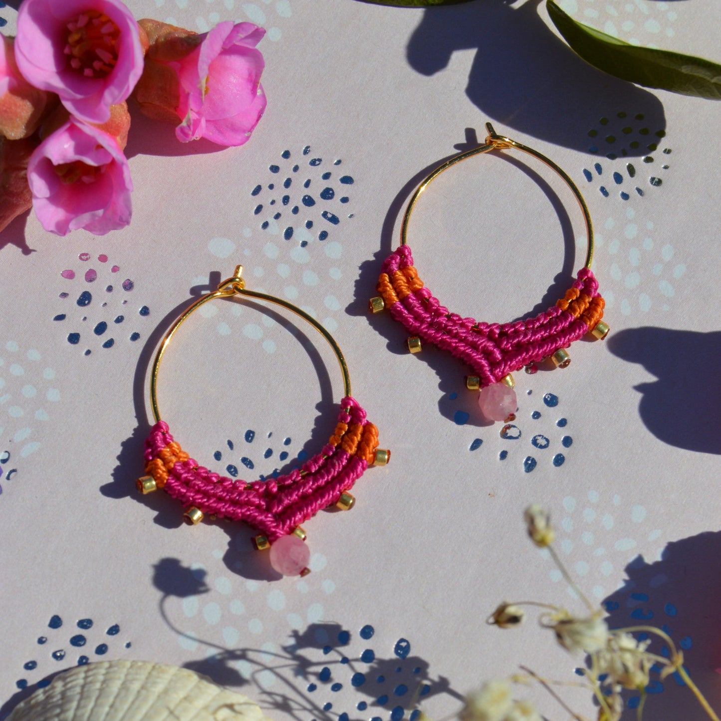 Small gold-plated sterling silver creole with macrame details in cerise pink & orange colour and a tourmaline gemstone.