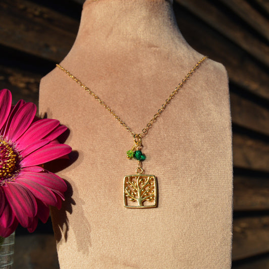 Gold-plated sterling silver necklace with Tree of Life charm and Czech glass bicones and a crystal.