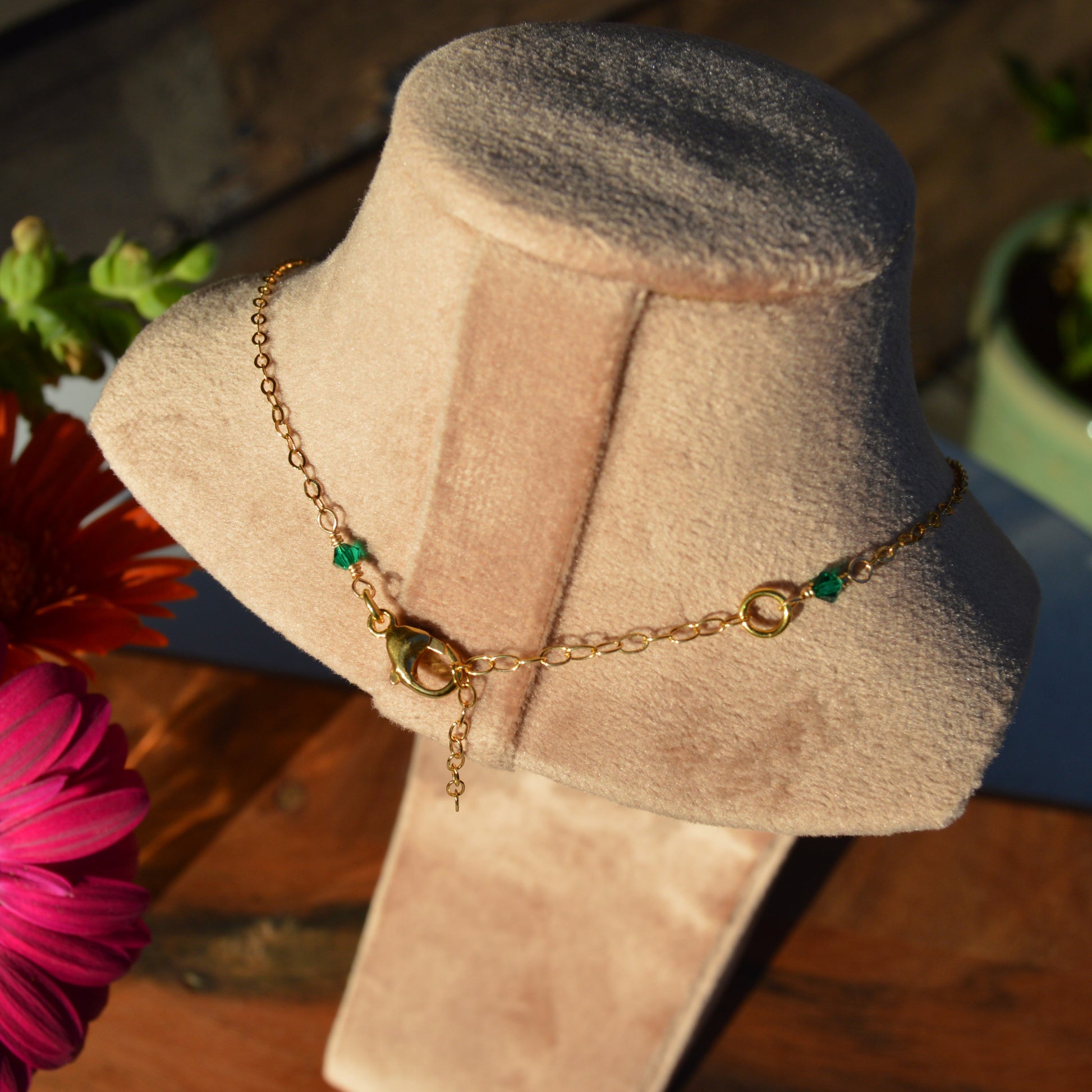 Extension chain and Czech glass bicones as a decoration on the back side.