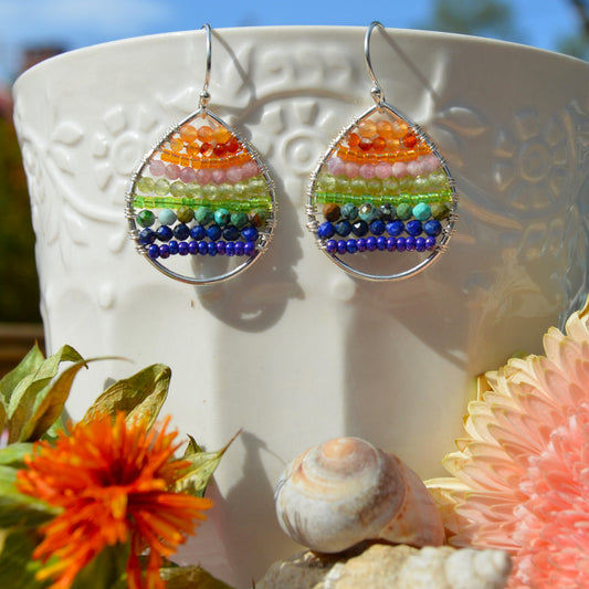 Sterling silver drop earrings woven with gemstones and seed beads. Colourful Magic to brighten up your day.