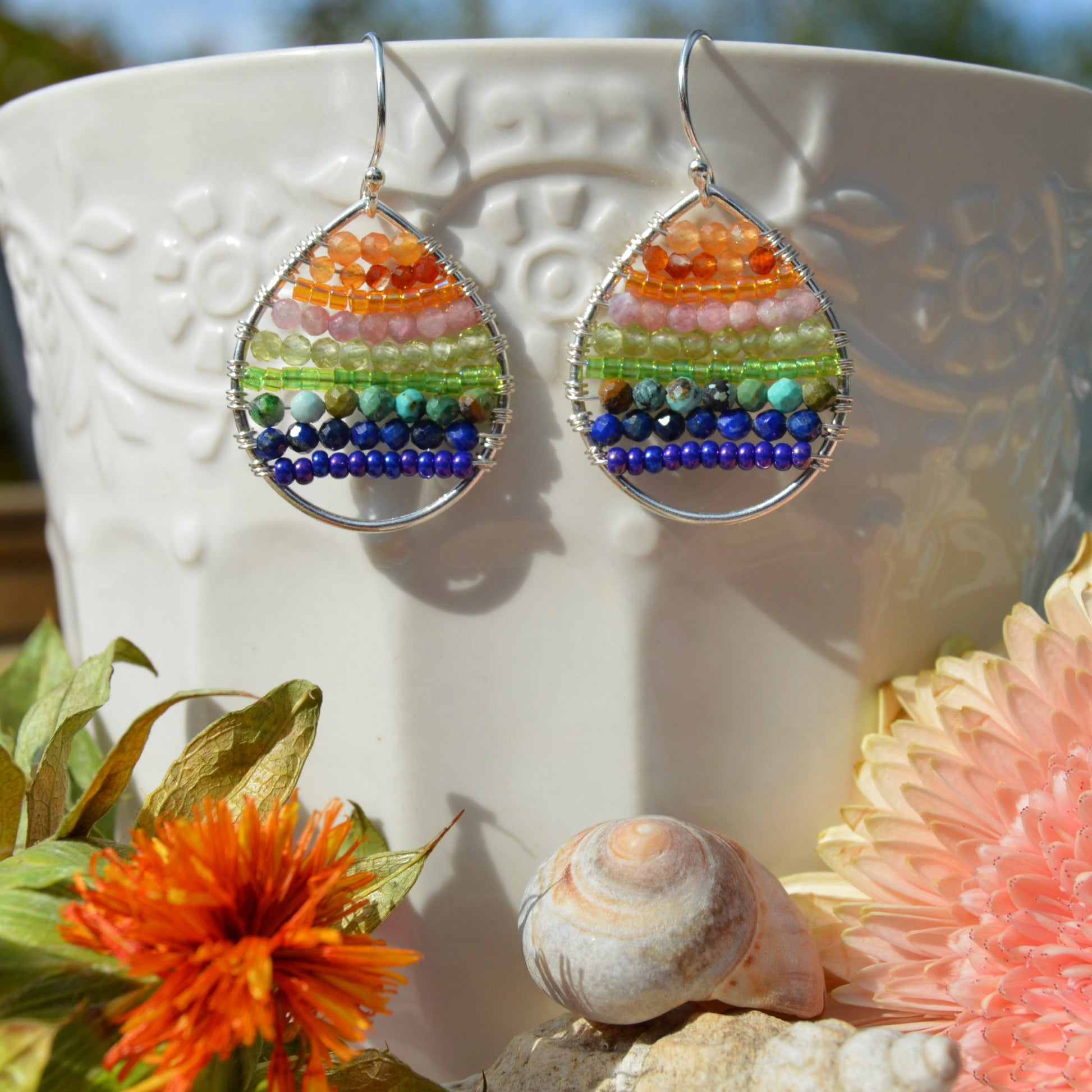 Sterling silver drop earrings woven with gemstones and seed beads. Colourful Magic to brighten up your day.