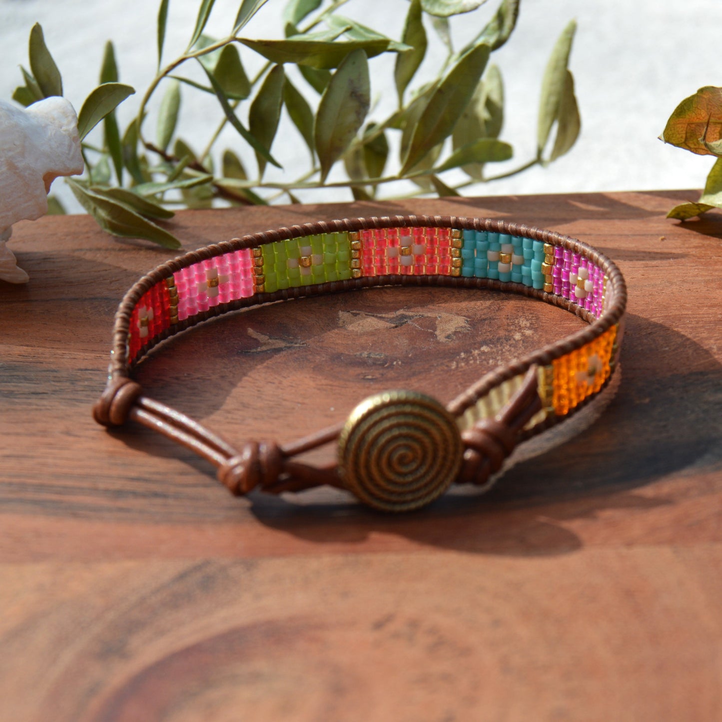 Boho leather wrap with woven Japanese seed beads and a button as a lock. Extension in leather.