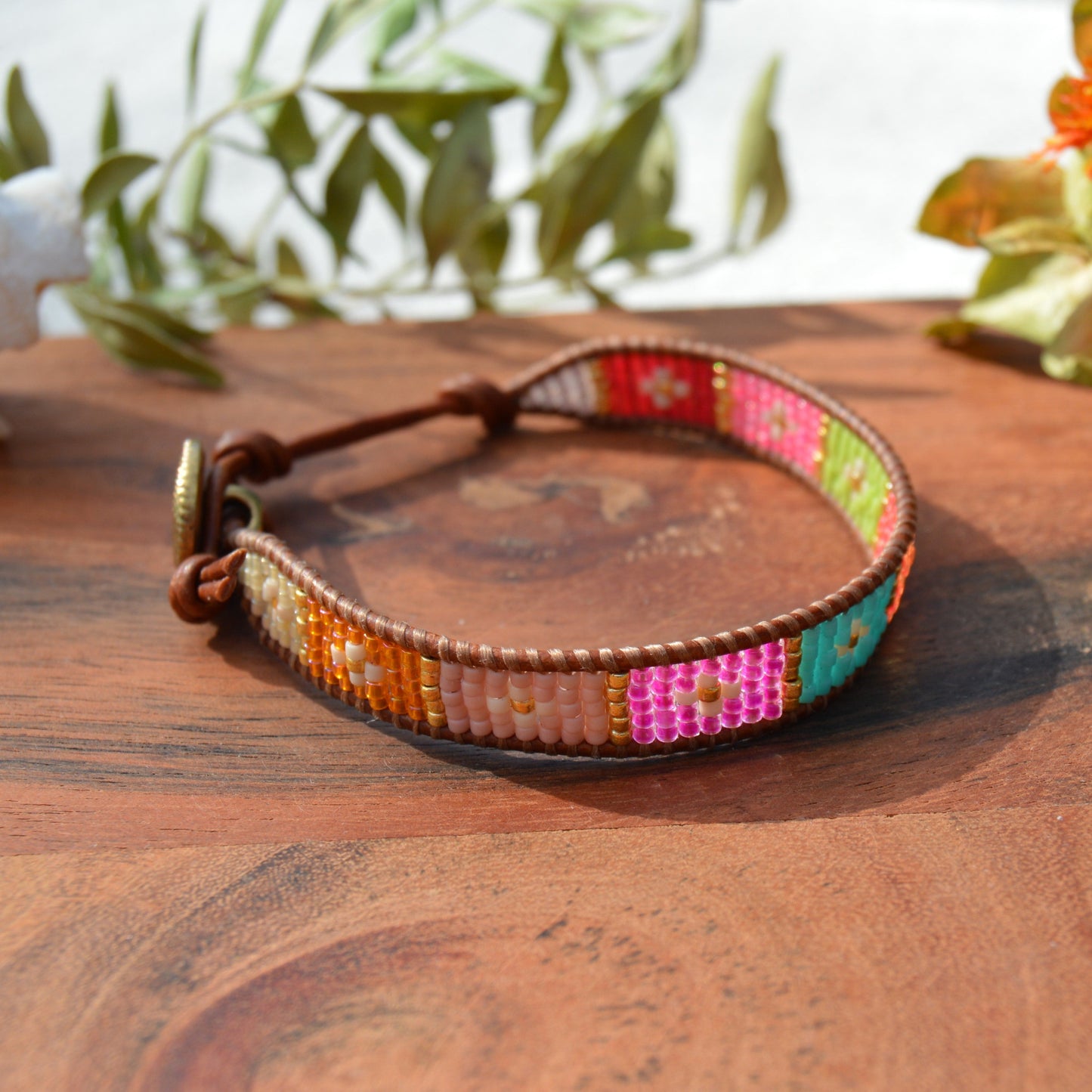 Boho leather wrap with woven Japanese seed beads and a button as a lock. Extension in leather.