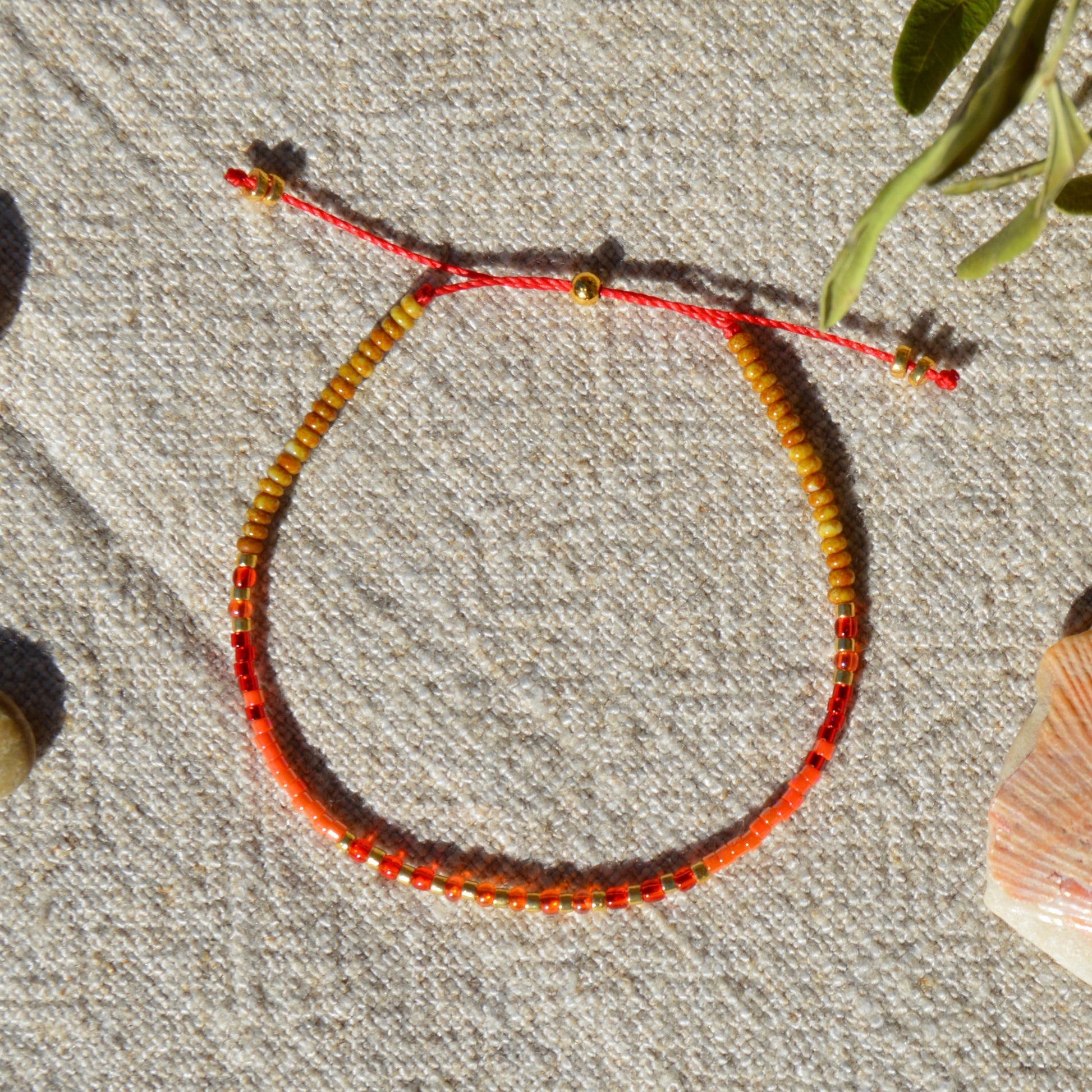 Adjustable seed beads bracelet with silicone stopper bead in gold-plated sterling silver. Nature inspired bracelet Closer to the Sun.
