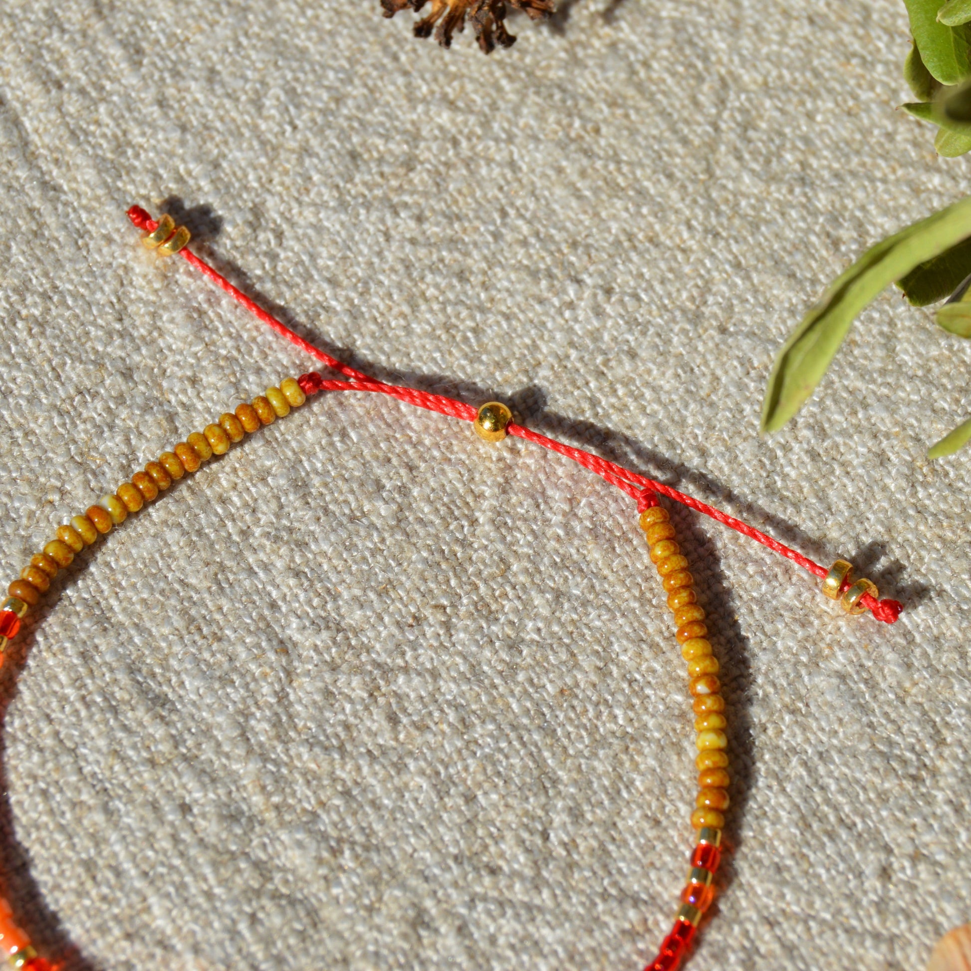 Adjustable seed beads bracelet with silicone stopper bead in gold-plated sterling silver. Nature inspired bracelet Closer to the Sun.