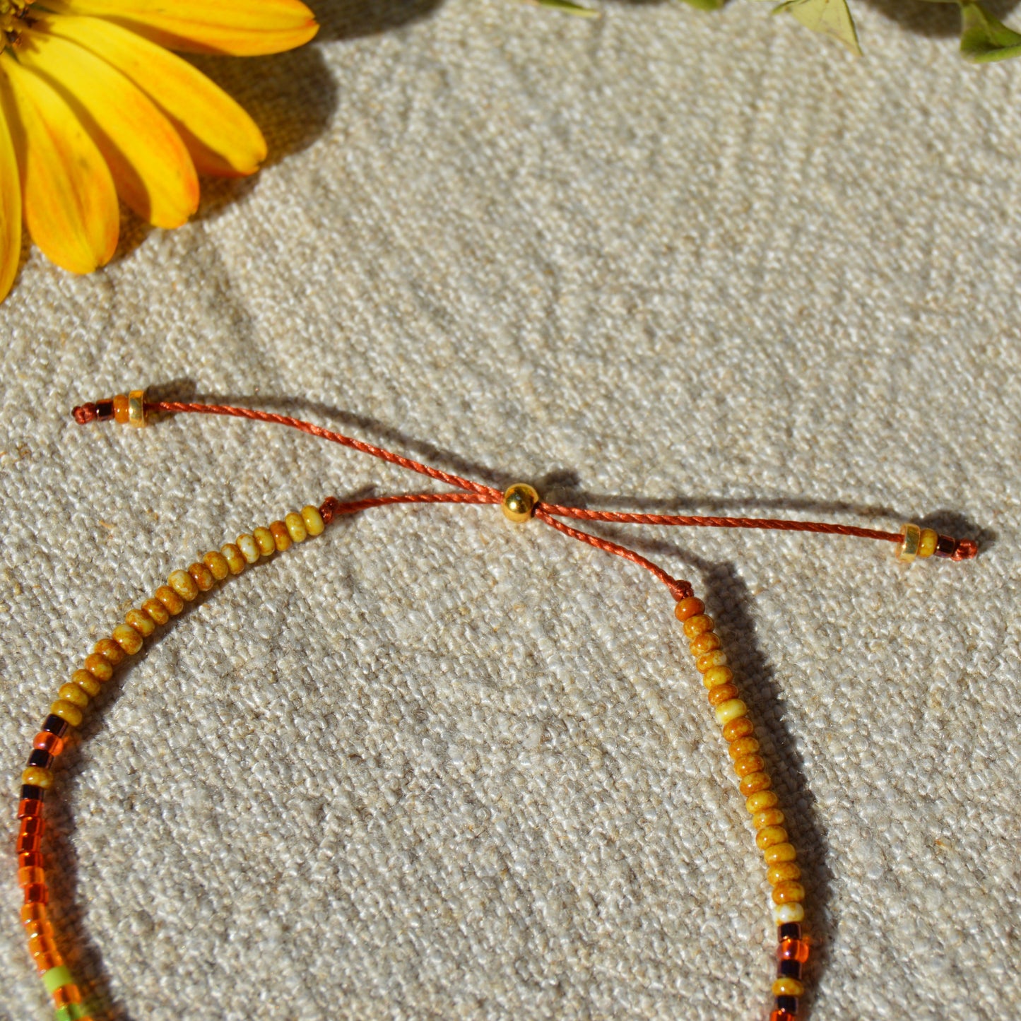 Adjustable seed beads bracelet with silicone stopper bead in gold-plated sterling silver. Nature inspired bracelet Closer to the Earth.