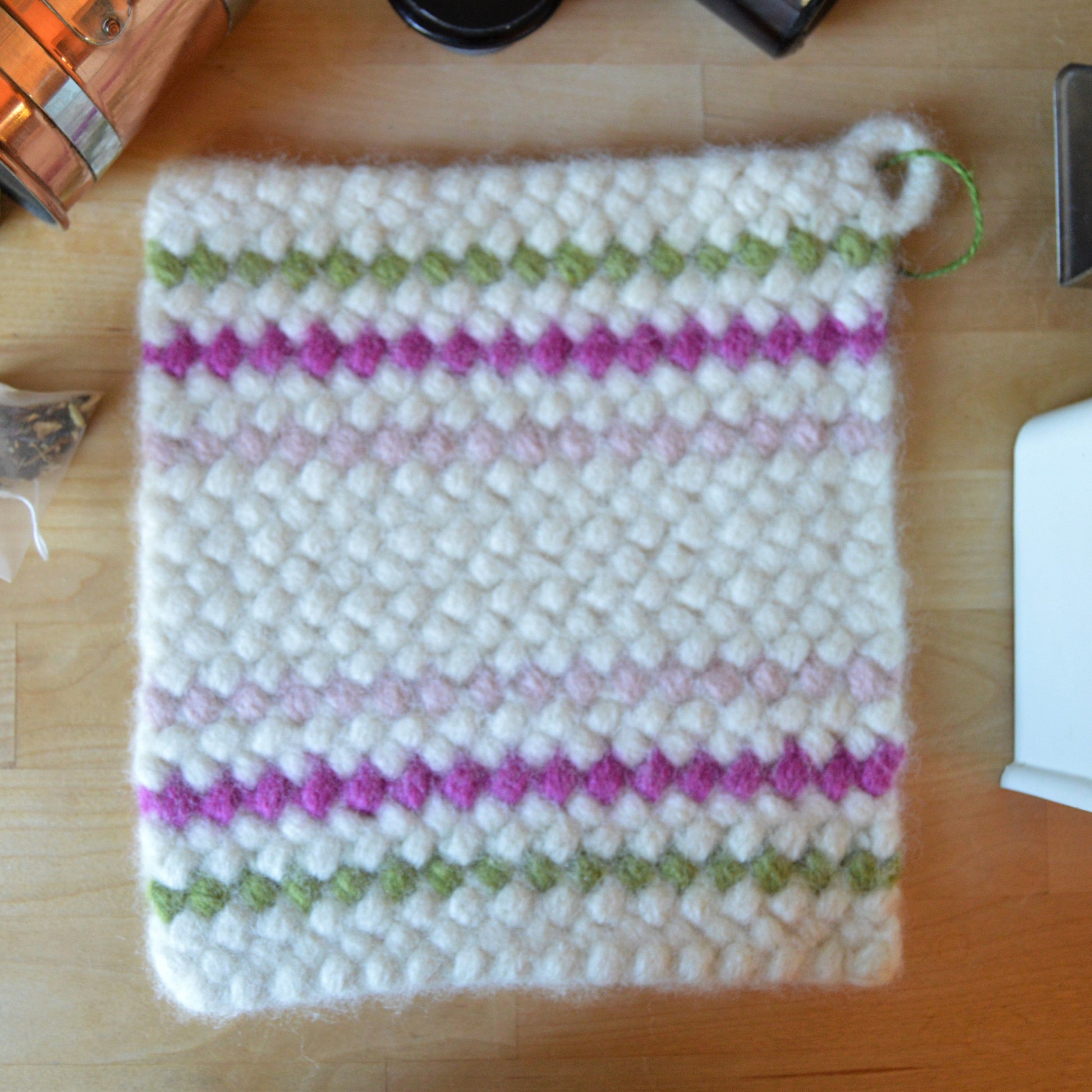 Crochet and felted potholder in wool - pink & green stripes.